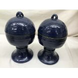 A pair of blue Oriental round lidded pedestal bowls with raised marks to lid and base,