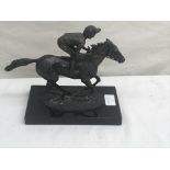 A bronze racehorse and jockey,