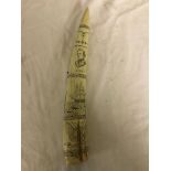 A piece of resin scrimshaw