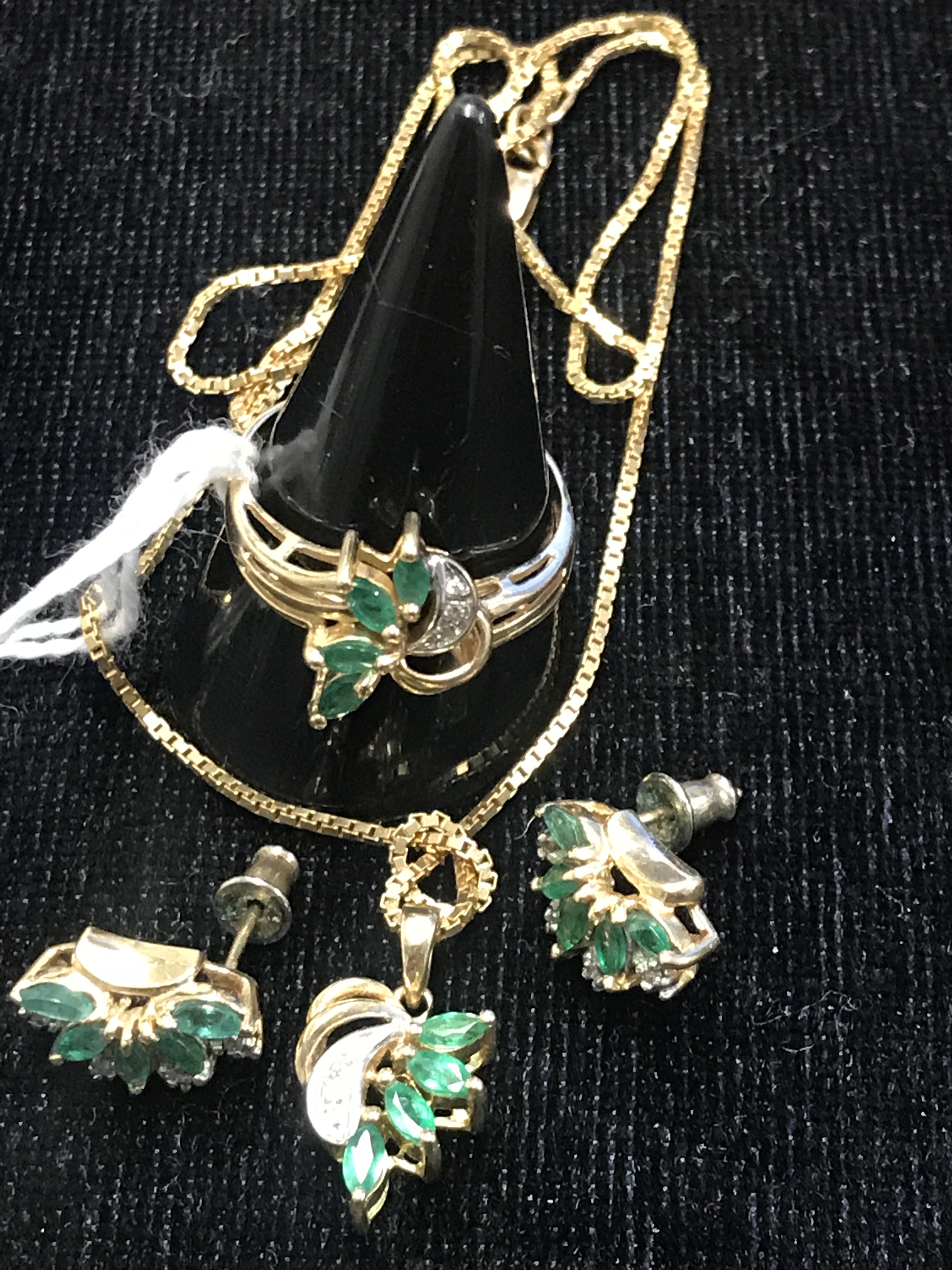 An emerald and diamond pendant,