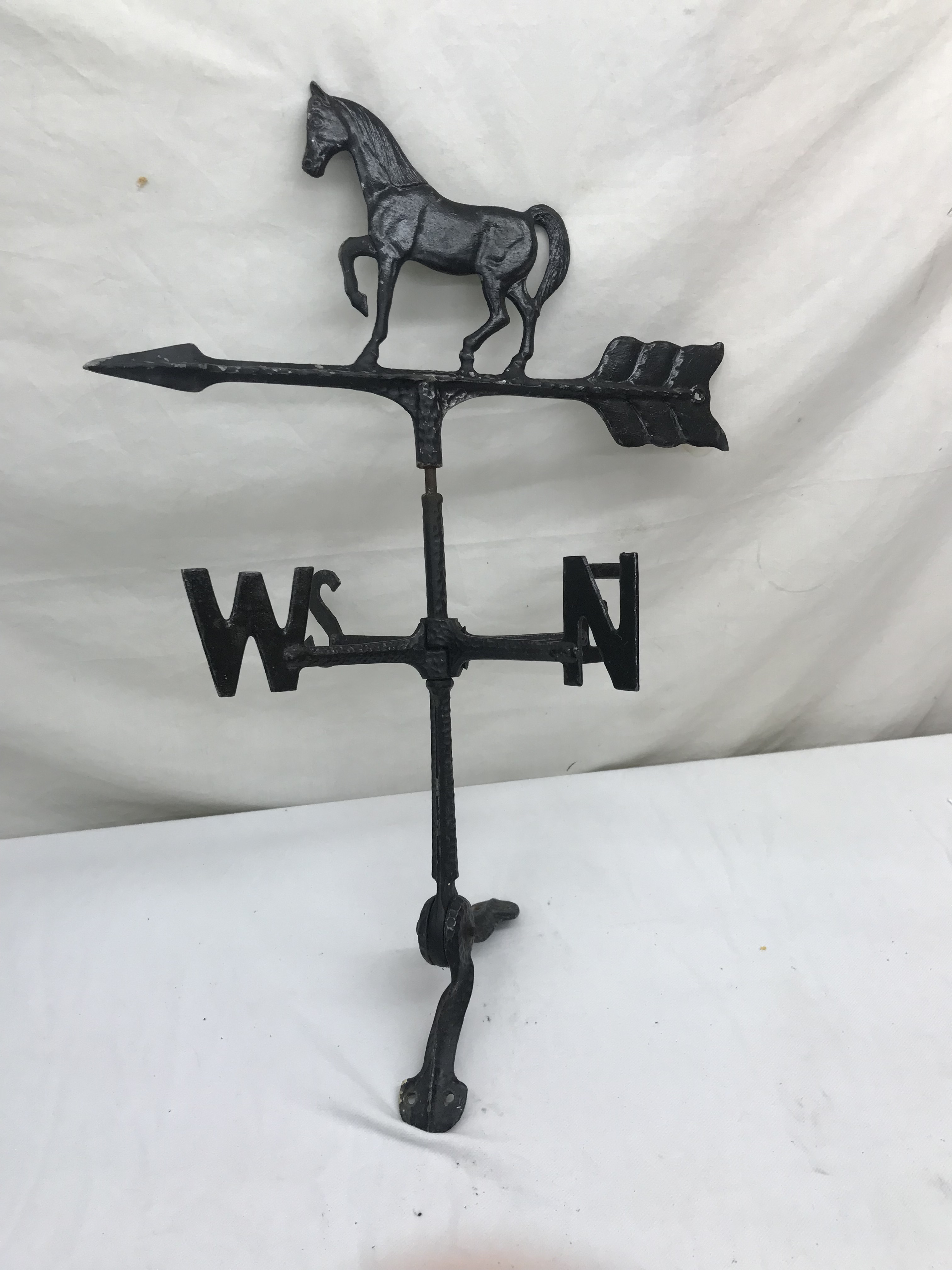 A meta weather vane in the form of a horse