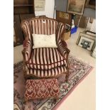 A French style armchair together with a matching footstool