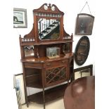 An Edwardian mahogany display cabinet with mirrored back