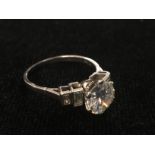 An 18ct diamond solitaire with baguette set shoulders 3ct spread moe measures 2.