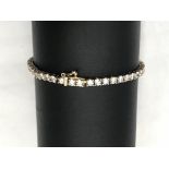 A CZ 9ct graduated bracelet