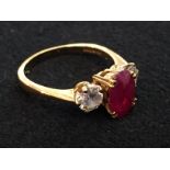 An 18ct ruby and diamond dress ring