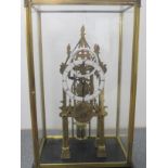 An architectural skeleton clock in a glass case: 44cm