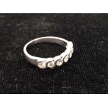 An 18ct diamond half eternity ring