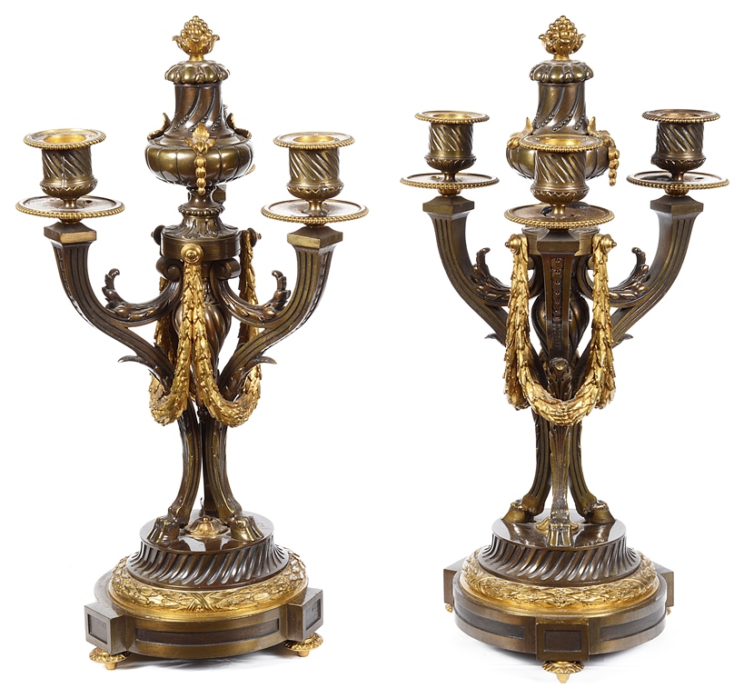 A Pair of Bronze Candelabra: 19th century, gilt and bronze three sconce candelabra,