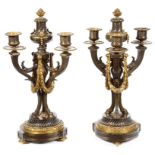 A Pair of Bronze Candelabra: 19th century, gilt and bronze three sconce candelabra,