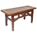 A Chinese Hardwood & Bamboo Slat Topped Table: In traditional style with carved floral motifs to