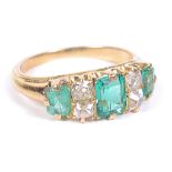 An Emerald and Diamond Cluster Ring: Unhallmarked 18 ct gold ring set with three emerald cut