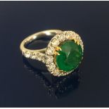 An 18ct large 6ct Zambian emerald ring with diamond set shoulders