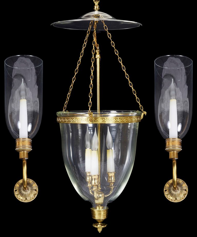 Two glass encased Regency style chandeliers and two wall lamps