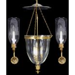 Two glass encased Regency style chandeliers and two wall lamps