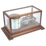 A Cased Glass Barograph by Negretti and Zambra: In oak case with hinged top,
