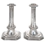 A Pair of Queen Anne Period Candlesticks: In traditional period form with column top and cartouche