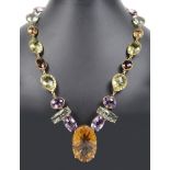 A Heavy 18ct Abstract Mixed Stone Necklace: Comprising large honey topaz, topaz peridot,