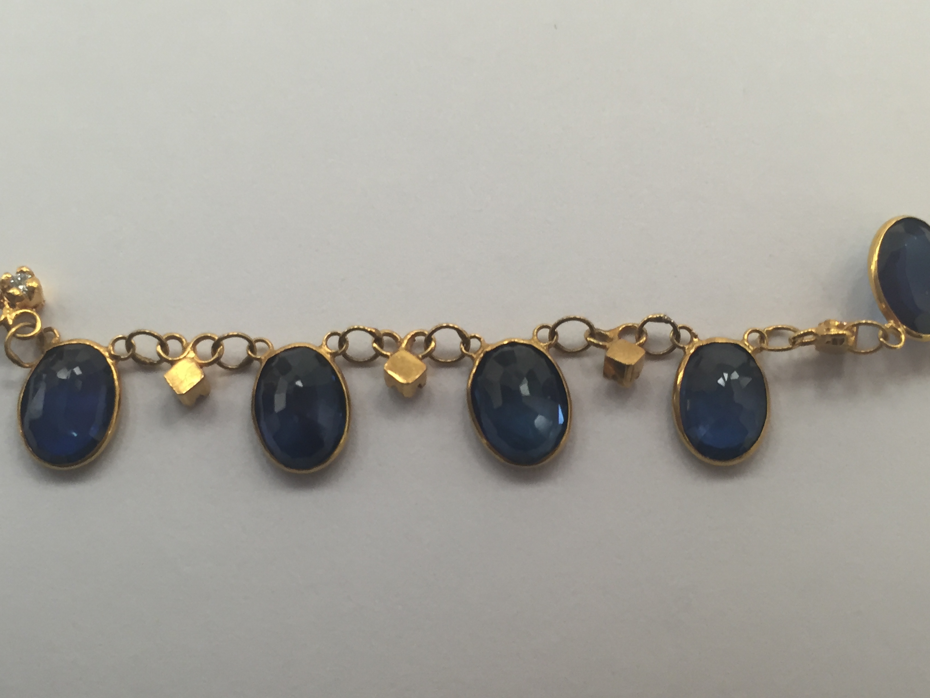 An 18ct Sapphire and Diamond Necklace: 18 oval cut sapphires interspersed with diamonds between - Image 4 of 5