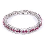 An Articulated Diamond and Ruby Bracelet: The bracelet in the form of diamond set leaves and a
