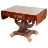An Empire Period Mahogany Sofa Table: Mahogany with two drop leaves supported by pull out planks,