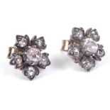 A Pair of Rose Cut Diamond Cluster Earrings: In floral form with central oval cut diamonds