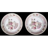 A Pair of Chinese Famille Rose Plates: Depicting figural scenes with utensils,