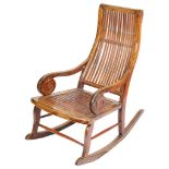 A 19th Century Chinese Rocking Chair: With carved spur scrolls to the sides and bamboo slat seat,