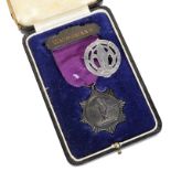 A 1938 England v Scotland Golf Medal & Glasgow School of Art Badge: The cased golf medal in Walker