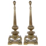 A Pair of Early George II Brass Andirons: Large brass andirons comprising a reeded bulbous finial