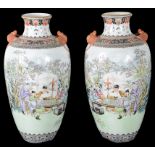 A Pair of Chinese Vases: Depicting figural garden scenes with seated officials reading scrolls.
