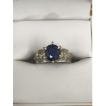 A 9ct diamond and sapphire ring