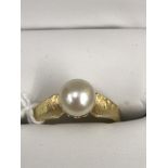 An 18ct pearl ring