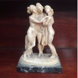 A small figural sculpture of The Three Graces,