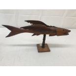 A carved figure of a fish