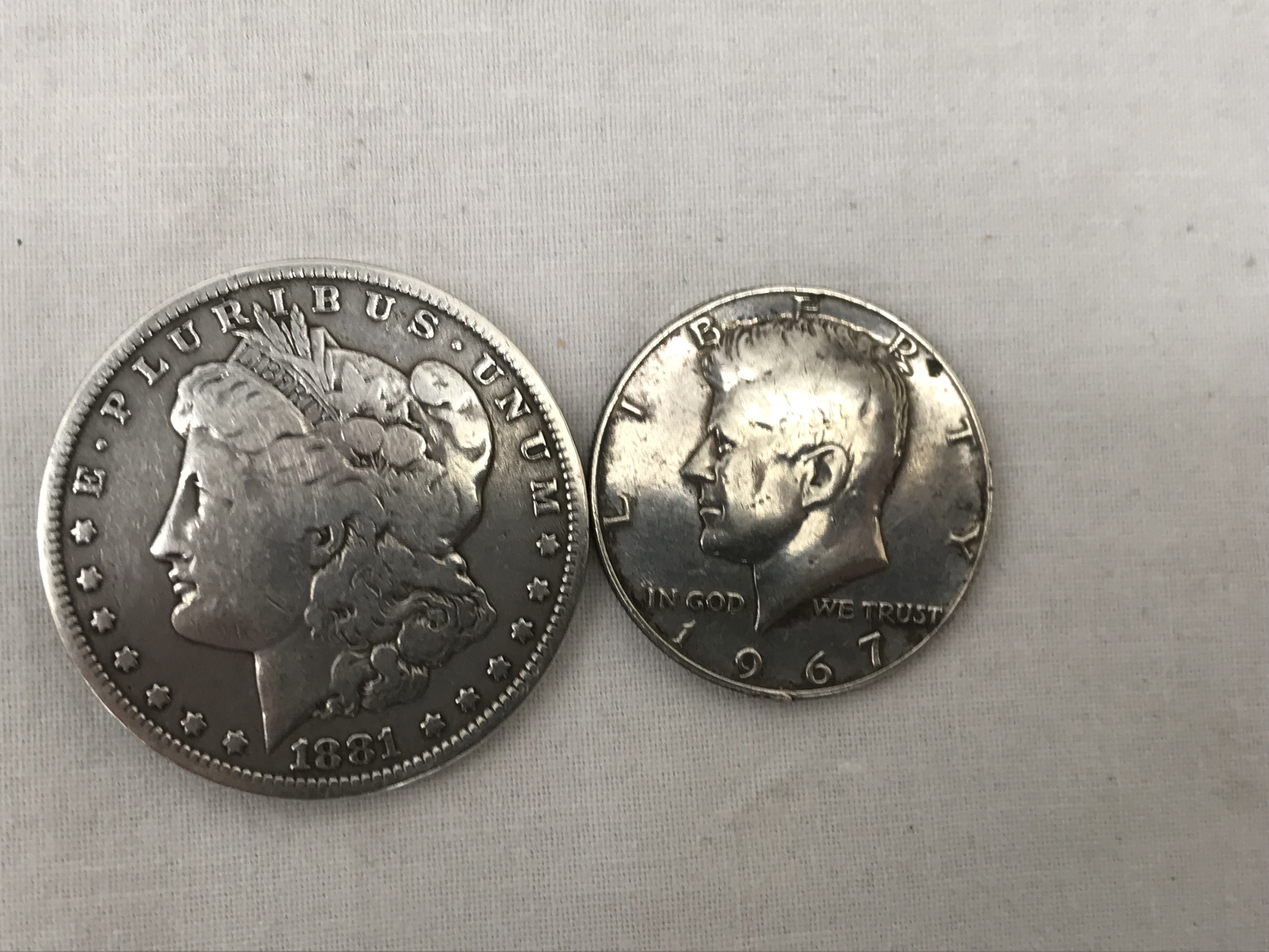 A 1966 Morgan dollar;