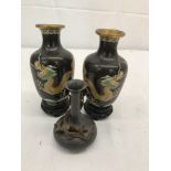 A pair of Chinese cloisonne vases depicting dragons chasing flaming pearls;