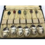 Coffee spoons with semi-precious finial tops by Liberty & Co