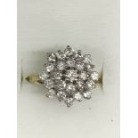 An 18ct diamond cluster ring: approx 1.