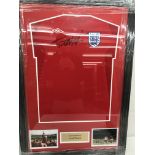 A framed and glazed signed England shirt by Geoff Hurst,