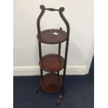 An Edwardian mahogany cake stand