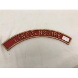 A bronze semi-circular steam train locomotive nameplate plaque: Lincolnshire.