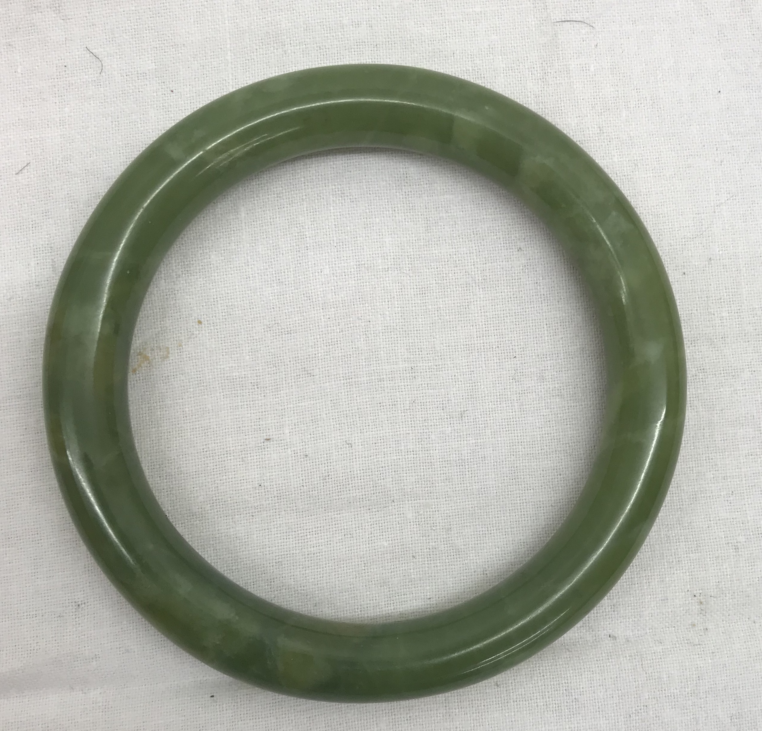 An 18th/19th century jade carved bangle