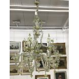 A Murano glass 12 branch chandalier of large proportions, wih leaf and floral fittings and designs.