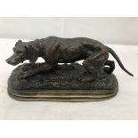 A bronze figure of a dog,