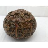 A Peruvian Gourde engraved with European figures on horseback with buildings and floral decoration
