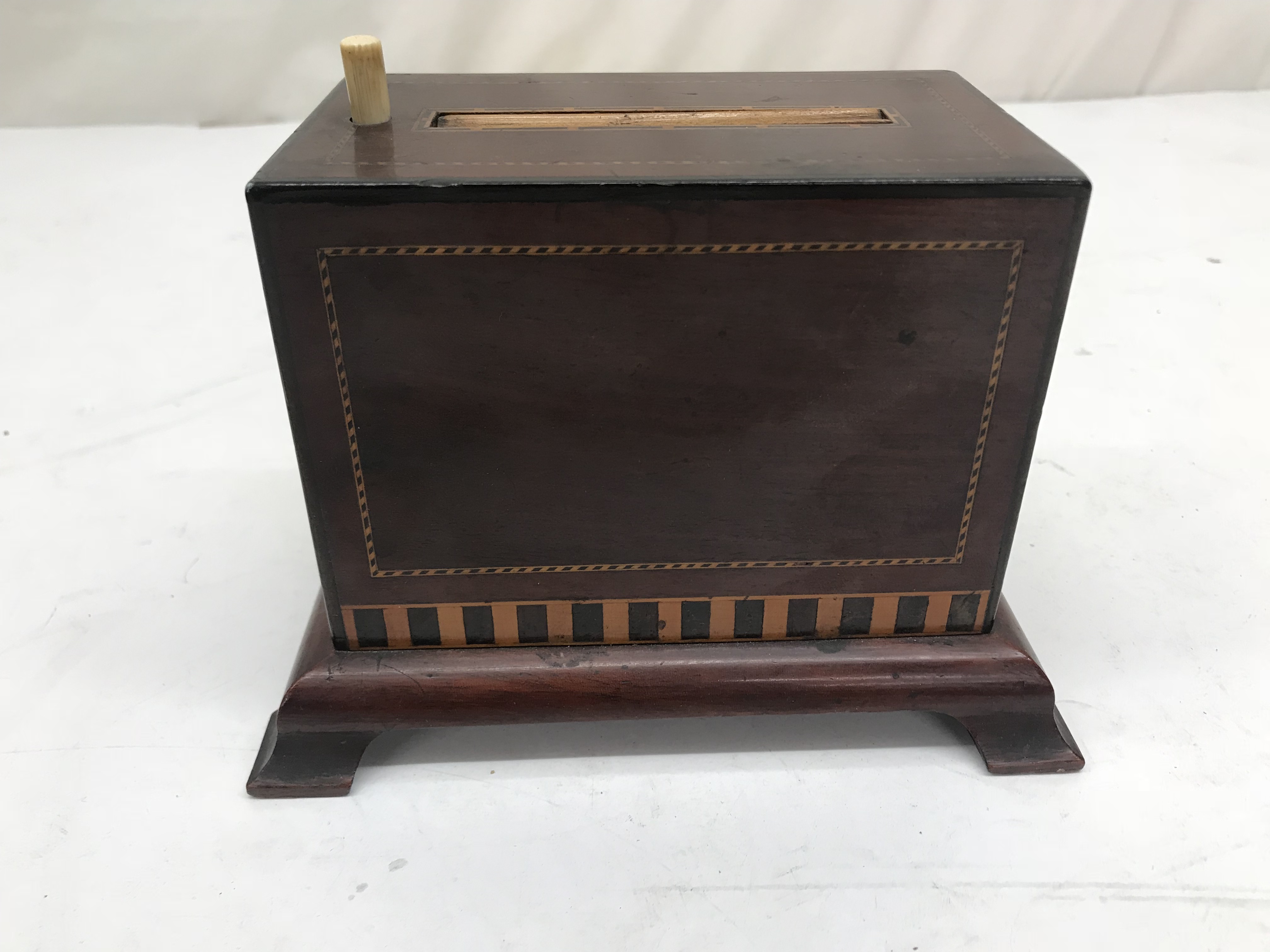 A mahogany Edwardian cigarette box;