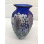 An Okra glass vase blue ground with floral designs,