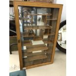 A glazed Oriental display cabinet