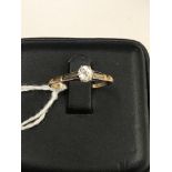 An 18ct oval old cut diamond solitaire